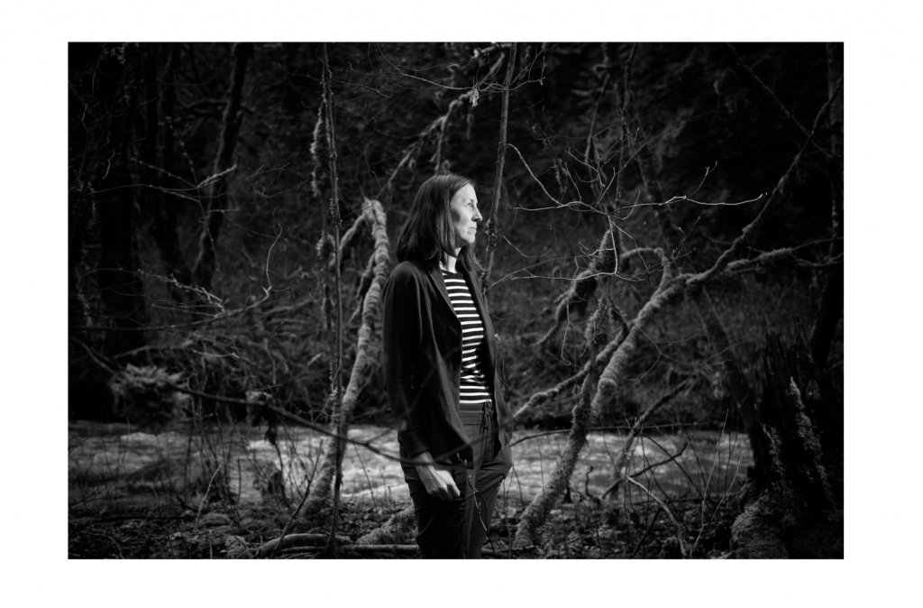 black and white portrait, outdoors, forest and river
