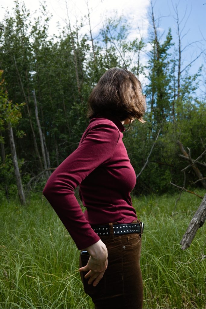 standing in a green field